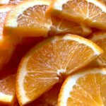 Home Bright and vibrant orange slices showcasing their juicy texture and fresh appeal.